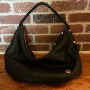 Large black Vince Camaro bag with tassel detail